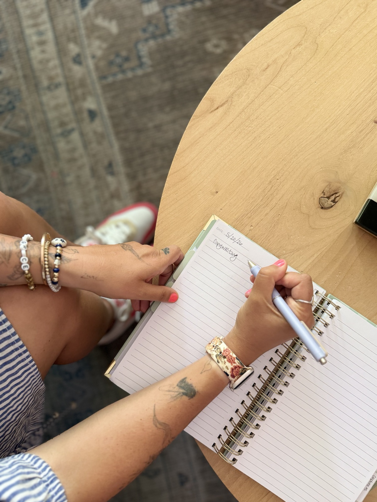 Cassidy Myers-Sims writing in a notebook